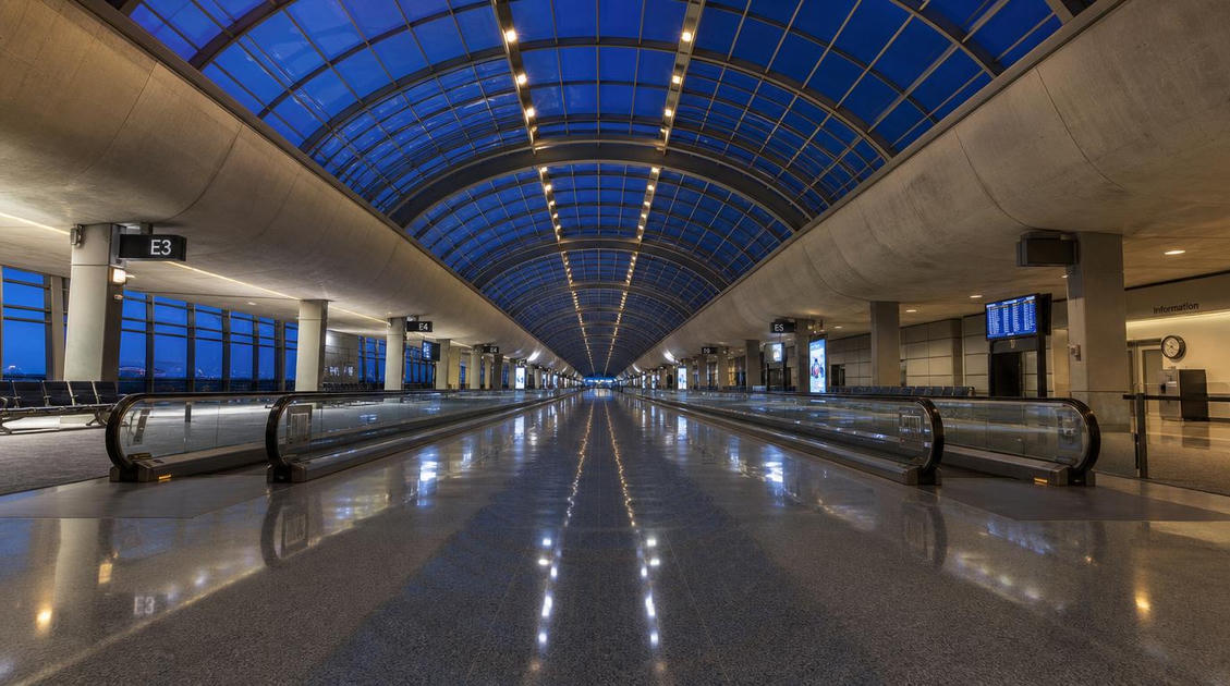 gpt image 2 A vast empty airport terminal stretching toward a vanishing point polished floor 5
